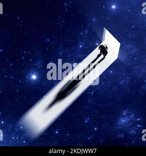 Le cosmonaute astronaute se tient sur le passage de la lumière à l'obscurité de l'espace. Silhouette de l'homme dans l'espace, l'ombre, le portail vers l'inconnu. À la recherche de n Banque D'Images