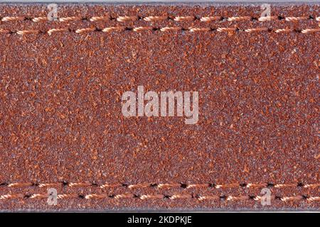 Similicuir marron avec double couture. Photographie macro. Banque D'Images