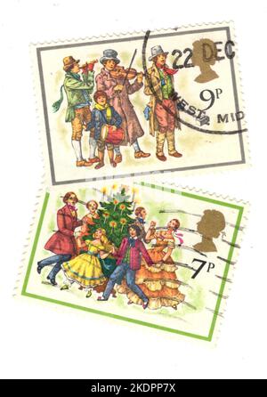 Timbres de Noël vintage du Royaume-Uni sur fond blanc. Banque D'Images