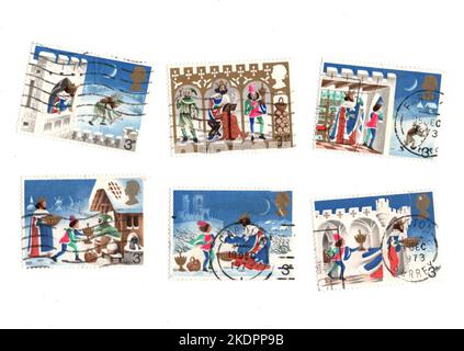 Timbres de Noël vintage du Royaume-Uni sur fond blanc. Banque D'Images