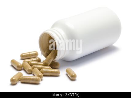 Bouteille de pillules déversées Couper sur blanc. Banque D'Images