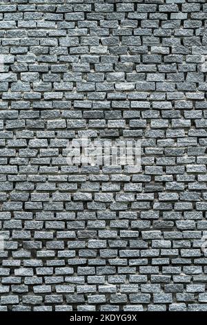 Remplissez le cadre avec un arrière-plan de mur en briques grises, une image verticale, une condition d'altération et une image de lumière du jour. Banque D'Images