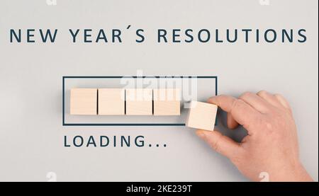 Nouvelles résolutions de l'année chargement, réalisation de plans, objectifs pour l'avenir Banque D'Images
