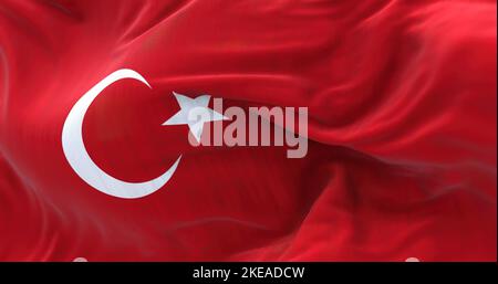 Vue rapprochée du drapeau national de la Turquie qui agite. La République de Turquie est un pays transcontinental. Arrière-plan texturé en tissu. Mise au point sélective. 3 Banque D'Images