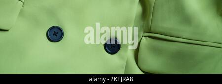 Blouse de veste vert clair avec boutons noirs Banque D'Images