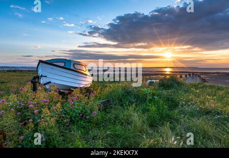 Coucher de soleil sur la côte nord du Kent à Whitstable Banque D'Images