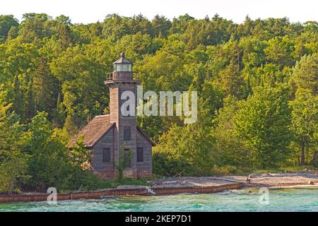 Old East Channel Lighthouse Hiding in the Forest on Grand Island in Michigan Stock Photo