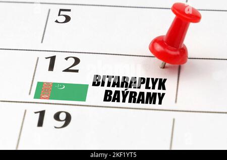 Jours fériés. Sur la grille du calendrier, la date et le nom du jour férié - Turkménistan - jour de la neutralité Banque D'Images