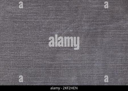 Un Jean gris denium gros plan, fond avec espace pour le texte. Vue des détails des jeans anciens. Fond denim, texture Banque D'Images