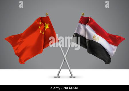 Deux drapeaux croisés Wavy de la Chine et de l'Égypte, signe des relations chinoises et égyptiennes Banque D'Images