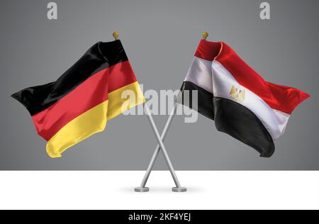 Deux drapeaux croisés Wavy de l'Allemagne et de l'Egypte, signe des relations allemandes et égyptiennes Banque D'Images