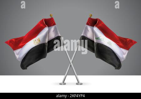 Deux drapeaux croisés Wavy de l'Égypte et de l'Irak, signe des relations égyptiennes et irakiennes Banque D'Images