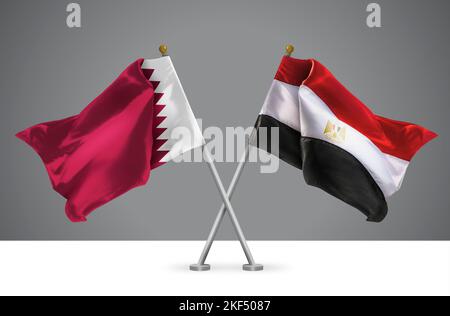 Deux drapeaux croisés Wavy de l'Égypte et du Qatar, signe des relations égyptiennes et Qatari Banque D'Images