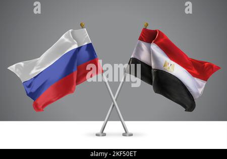 Deux drapeaux croisés Wavy de l'Égypte et de la Russie, signe des relations égyptiennes et russes Banque D'Images