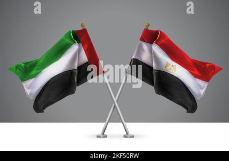 Deux drapeaux croisés Wavy de l'Égypte et des Émirats arabes Unis, signe des relations égyptiennes et émirati Banque D'Images