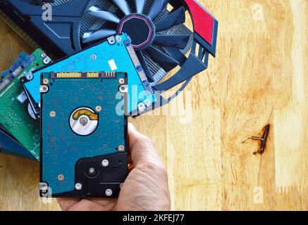 Hard disk drives are still widely used. hard drive in hand Banque D'Images