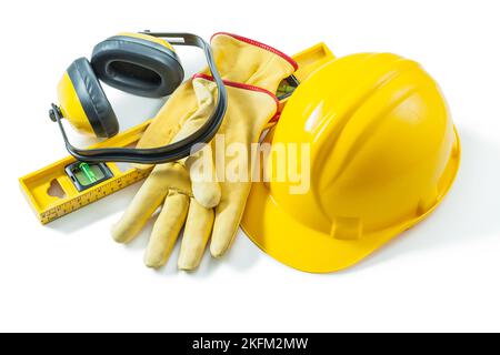 construction outils de travail casque gants écouteurs de niveau isolés sur fond blanc Banque D'Images