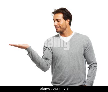 Vivre son style de vie. Studio photo d'un beau jeune homme isolé sur blanc. Banque D'Images