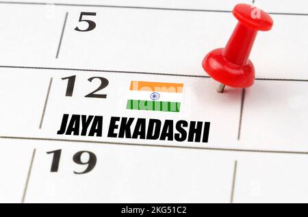 Jours fériés. Sur la grille du calendrier, la date et le nom du congé - Jaya Ekadashi Banque D'Images