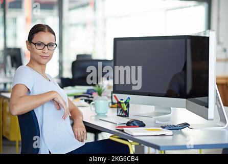 Developing tomorrows tech today. a designer at their workstation in an office. Stock Photo