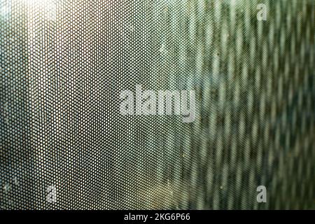 Surface en verre dans le film. Texture du film sur la fenêtre. Arrière-plan flou des petites vagues. Détails du film. Banque D'Images