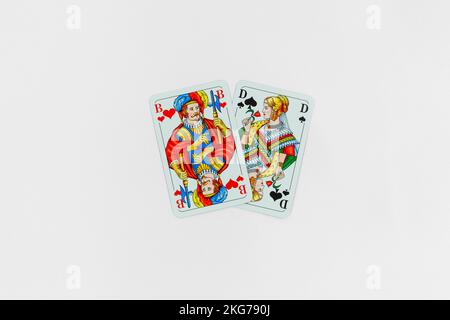 cartes de poker sur fond blanc, homme et femme Banque D'Images