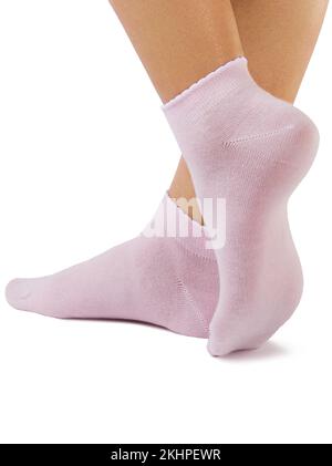 Vue latérale de la magnifique femme pied habillé dans de nouvelles belles et doux coton naturel blanc chaussettes roses Banque D'Images