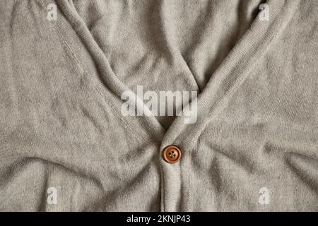 Veste grise élégante pour homme avec boutons pour arrière-plan, vêtements élégants et en gros plan Banque D'Images