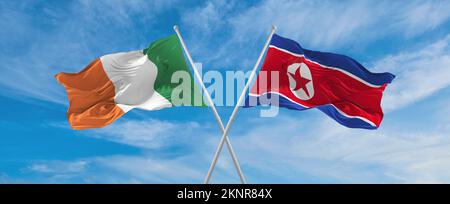 Deux drapeaux croisés la Corée du Nord et l'Irlande agitant sous le vent à ciel nuageux. Concept de relation, de dialogue, de voyage entre deux pays. 3d illustrateur Banque D'Images