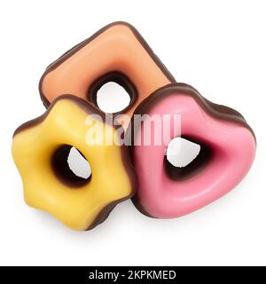 Bonbons de noël jaune, orange et rose trempés dans du chocolat isolé sur du blanc. Vue de dessus. Banque D'Images