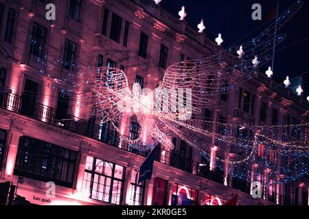 Éclairage de Noël à Londres avec la foule Banque D'Images