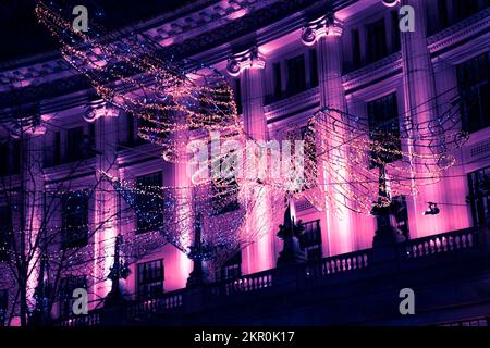 Éclairage de Noël à Londres avec la foule Banque D'Images