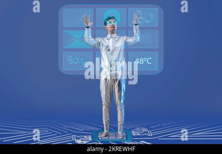 Un homme portant des vêtements argentés futuristes travaillant sur un écran virtuel. Un concept technologique futur Banque D'Images