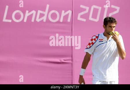 FICHIER PHOTO le joueur de tennis croate Marin Cilic a été suspendu de jouer pendant neuf mois pour violation des lois sur le dopage. La Fédération internationale de tennis (ITF) déclare que la suspension sera datée à l'arrière de 1 mai, il pourra donc retourner sur le circuit de tennis de 31 janvier 2014. Cilic a été testé positif pour le nikéthamide, un stimulant qui affecte le cycle respiratoire de l'utilisateur, à Munich. 01.08.2012., Londres - Jeux Olympiques Londres 2012., Marin Cilic, Ivan Dodig - Johan Brunstrom, Robert Lindstedt. Photo: Sanjin Strukic/PIXSELL Banque D'Images