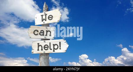 Nous pouvons vous aider - panneau en bois avec trois flèches Banque D'Images
