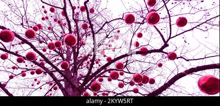 Le tronc et la couronne d'un arbre d'hiver avec des boules brillantes de différentes tailles dans la couleur de 2023 viva magenta Banque D'Images