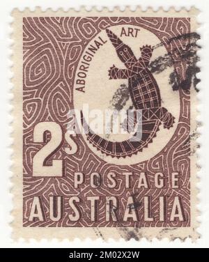 AUSTRALIE — 1948 16 février: Un timbre-poste au chocolat de 2 shillings représentant un Сrocodile comme exemple d'art aborigène Le crocodile d'eau douce (Crocodylus johnstoni), également connu sous le nom de crocodile d'eau douce australien, le crocodile de Johnstone ou la freshie, est une espèce de crocodile endémique dans les régions septentrionales de l'Australie. Contrairement à leur plus grand parent australien, le crocodile d'eau de mer, les crocodiles d'eau douce ne sont pas connus comme mangeurs d'hommes, bien qu'ils mpident en légitime défense, et de brèves attaques non fatales ont eu lieu, apparemment le résultat d'une identité erronée Banque D'Images