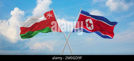 Deux drapeaux croisés la Corée du Nord et Oman agitant dans le vent à ciel nuageux. Concept de relation, de dialogue, de voyage entre deux pays. 3d illustrationratio Banque D'Images