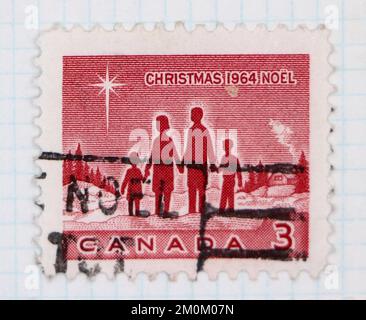 Photo d'un timbre-poste du Canada Noël de la famille canadienne 1964 Banque D'Images