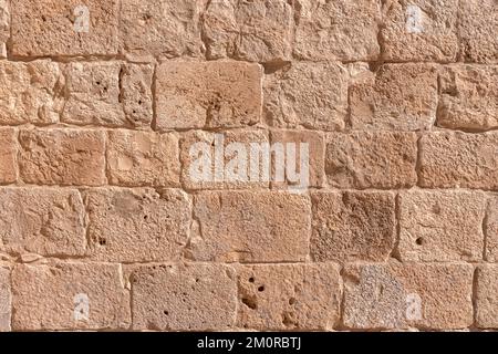 Surface de l'ancien mur fait de la pierre de Jérusalem. Israël Banque D'Images