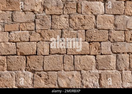 Surface de l'ancien mur fait de la pierre de Jérusalem. Israël Banque D'Images