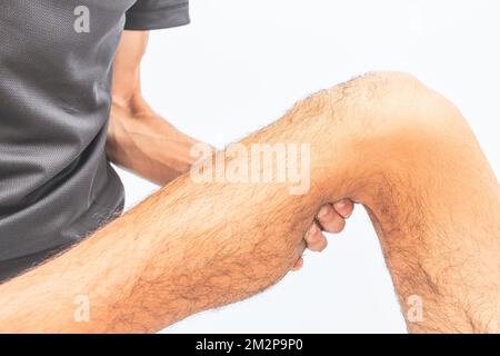 Mobilisation des membres inférieurs par Un thérapeute physique en Studio Banque D'Images