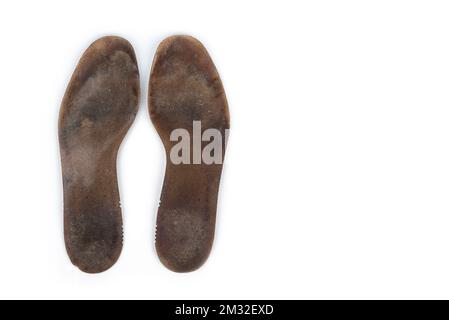 Semelles intérieures lourdes utilisées sur fond blanc Banque D'Images