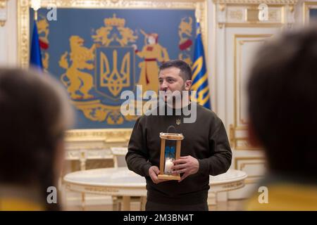 Kyiv, Ukraine. 14th Dec, 2022. Ukrainian Plast National Scout members present President Volodymyr Zelenskyy, with the Peace Light of Bethlehem during a visit to the Mariyinsky Palace, December 14, 2022 in Kyiv, Ukraine. Credit: Ukraine Presidency/Ukrainian Presidential Press Office/Alamy Live News Stock Photo