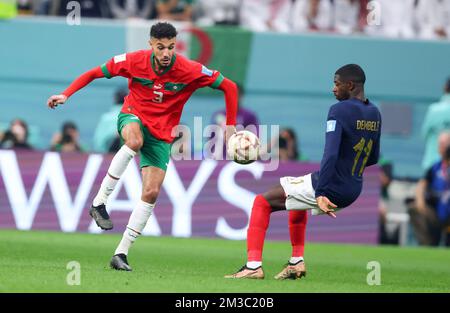 AL KHOR, QATAR - DECEMBER 14:  FIFA World Cup Qatar 2022 semi final match between France and Morocco at Al Bayt Stadium on December 14, 2022 in Al Khor, Qatar. Katar Frankreich - Marokko  Noussair Mazraoui of Morocco Ousmane Dembele of France  Fussball WM  2022 in Qatar  FIFA Football World Cup 2022 © diebilderwelt / Alamy Live News Stock Photo