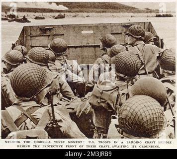 Des fantasins américains dans un embarcation se dirigeant vers la rive de la Normandie le matin du jour J, 6 juin 1944. Banque D'Images