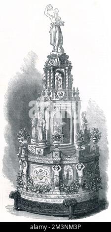 Un magnifique gâteau de mariage royal pour le mariage de la princesse Louise au marquis de Lorne en 1871, réalisé par le chef confiseur de la reine Victoria au château de Windsor. Il faisait 5 pi 4 pouces de haut avec un diamètre de 2ft 6 pouces. La base était décorée de satin blanc, de armoiries, des initiales L.L. entreminées de bleu, de couronnes de fleurs d'oranger et de petites vases contenant de petites fleurs. Dans une alcôve au-dessus de la base se trouvait la fontaine avec des colombes buvant et autour du temple miniature se trouvaient quatre statues représentant l'agriculture, les beaux-arts, le commerce et la science. La partie supérieure a été couronnée Banque D'Images