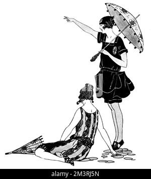 Deux femmes baignant dans Marshall & amp; Snelgrove maillots de bain, l'une tenant un parasol et pointant vers la mer. La dame assise sur la plage porte un maillot de bain en satin à dos de laine; la dame de droite a un maillot de bain de taffetas noirs, piqué de cerise. Date: 1923 Banque D'Images