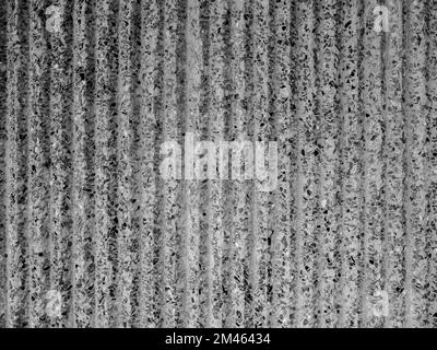 Arrière-plan abstrait de la texture du mur en béton ondulé. Papier peint moderne en pierre terrazzo avec motif vertical strié, noir et blanc. Ciment moderne s Banque D'Images