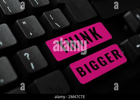 Écriture affichage du texte pensez plus grand. Approche d'entreprise être en mesure de rêver et de visualiser ce que vous pouvez réaliser Banque D'Images